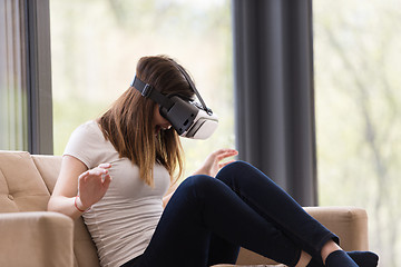 Image showing woman using VR-headset glasses of virtual reality