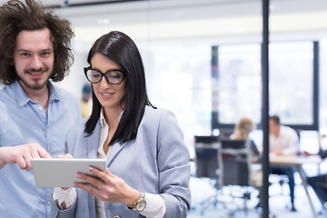 Image showing Business People Working With Tablet in startup office