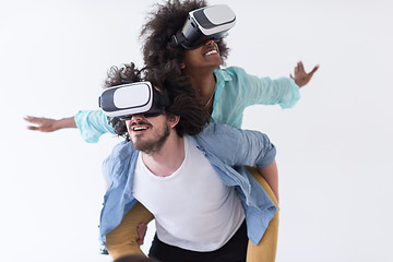 Image showing multiethnic couple getting experience using VR headset glasses