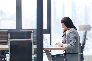 Image showing businesswoman using a laptop in startup office