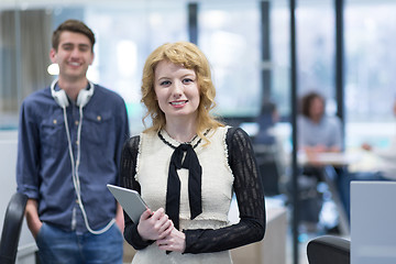 Image showing Business People Working With Tablet in startup office