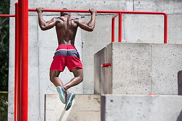 Image showing Athlete doing exercises at stadium