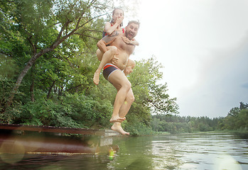 Image showing Enjoying river party with friends. Group of beautiful happy young people at the river together