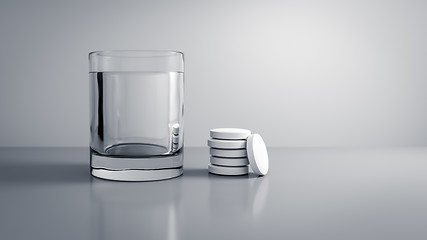 Image showing glass of water with some tablets
