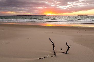 Image showing Sunrise over the ocean with beautiful unspoilt beach