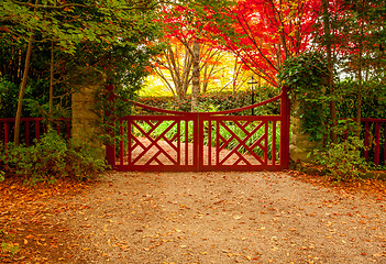 Image showing Red gate and autumn colours of beautiful gardens