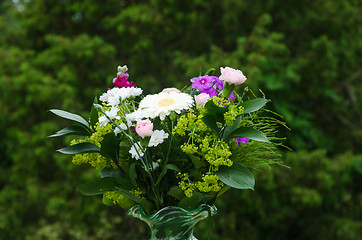 Image showing Summer flowers in a decorative bouquet with a green background