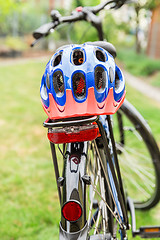 Image showing Bicycle with bike helmet on the rack