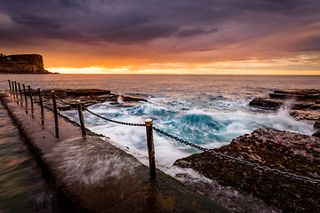 Image showing Coastal sunrise by ocean pool