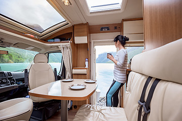 Image showing Woman in the interior of a camper RV motorhome with a cup of cof