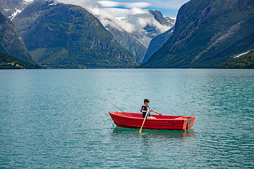 Image showing Woman fishing on a boat.