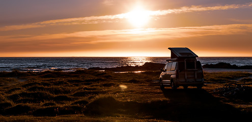 Image showing Camping car minivan on the beach at sunset Lofoten beach.