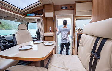 Image showing Woman in the interior of a camper RV motorhome with a cup of cof