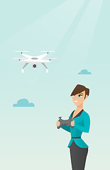 Image showing Young caucasian woman flying drone.