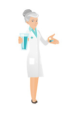 Image showing Senior pharmacist giving pills and glass of water.