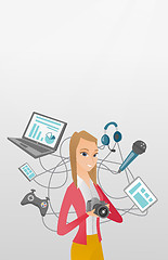 Image showing Young caucasian woman surrounded by her gadgets.