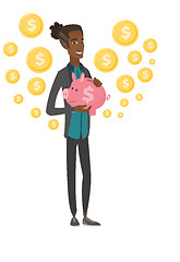 Image showing Young african businessman holding a piggy bank.