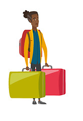 Image showing Disappointed tourist holding two big suitcases.