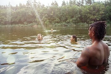 Image showing Enjoying river party with friends. Group of beautiful happy young people at the river together