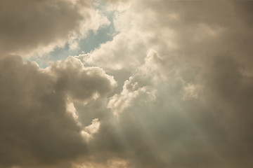 Image showing the clouds in the sky and the rays of the sun.