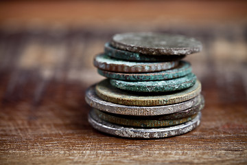 Image showing Stack of different ancient copper coins with patina.