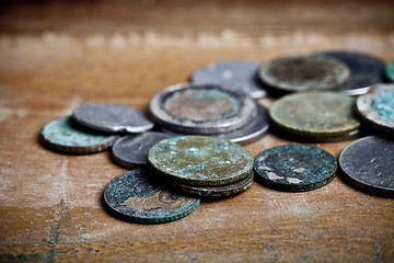 Image showing Pile of different ancient copper coins with patina.