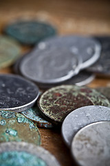 Image showing Tarnished and partially corroded old copper coins