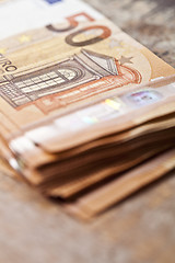 Image showing Pile of fifty euro banknotes.