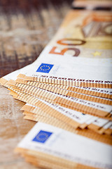 Image showing Pile of fifty euro banknotes. 50€ currency notes stacked. 