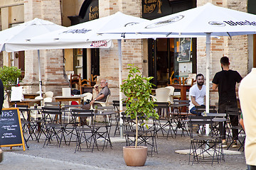 Image showing Fermo, Italy - June 23, 2019: People enjoying summer day and foo