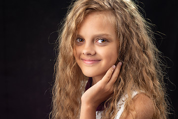 Image showing Close-up portrait of teenage girl on black background