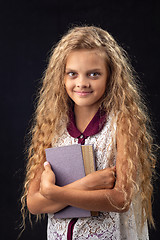 Image showing Portrait of a teenage girl with an old book