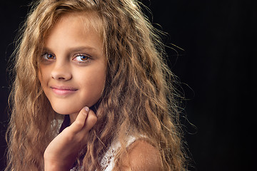 Image showing Portrait of a teenage girl with long curly hair