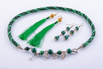 Image showing Necklace and two sets of earrings made of small beads and handmade stones