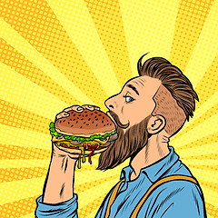 Image showing hipster man eating Burger