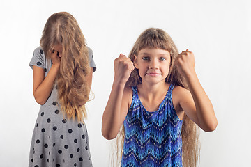 Image showing Girl rejoices that offended another girl