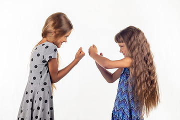 Image showing Two girls are fighting, studio white background