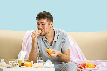 Image showing Young man suffering from allergy to citrus fruits