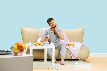 Image showing Young man suffering from allergy to citrus fruits