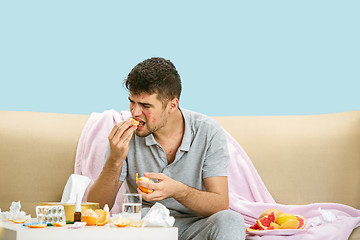 Image showing Young man suffering from allergy to citrus fruits