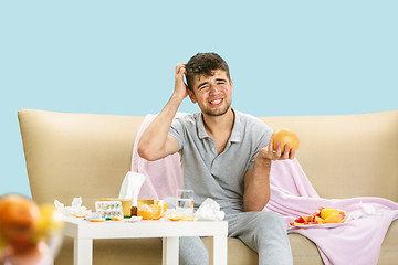 Image showing Young man suffering from allergy to citrus fruits