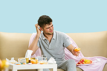 Image showing Young man suffering from allergy to citrus fruits