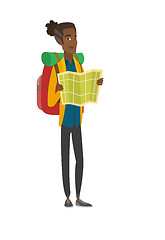 Image showing African traveler with backpack looking at map.