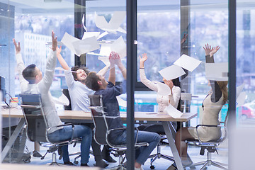 Image showing startup Group of young business people throwing documents