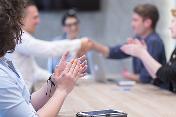 Image showing cloasing the deal in modern office interior