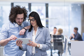 Image showing Business People Working With Tablet in startup office