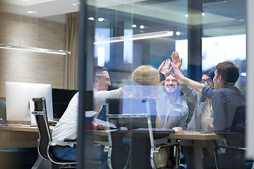 Image showing startup Group of young business people celebrating success