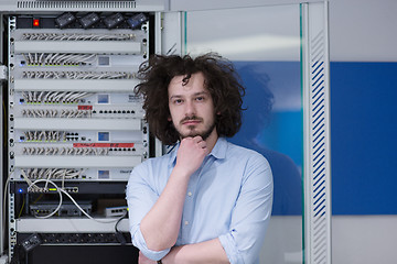 Image showing business man engeneer in datacenter server room