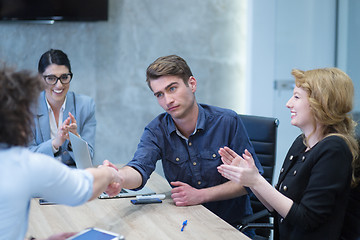 Image showing cloasing the deal in modern office interior