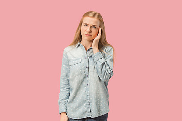 Image showing Woman having headache. Isolated over pink background.